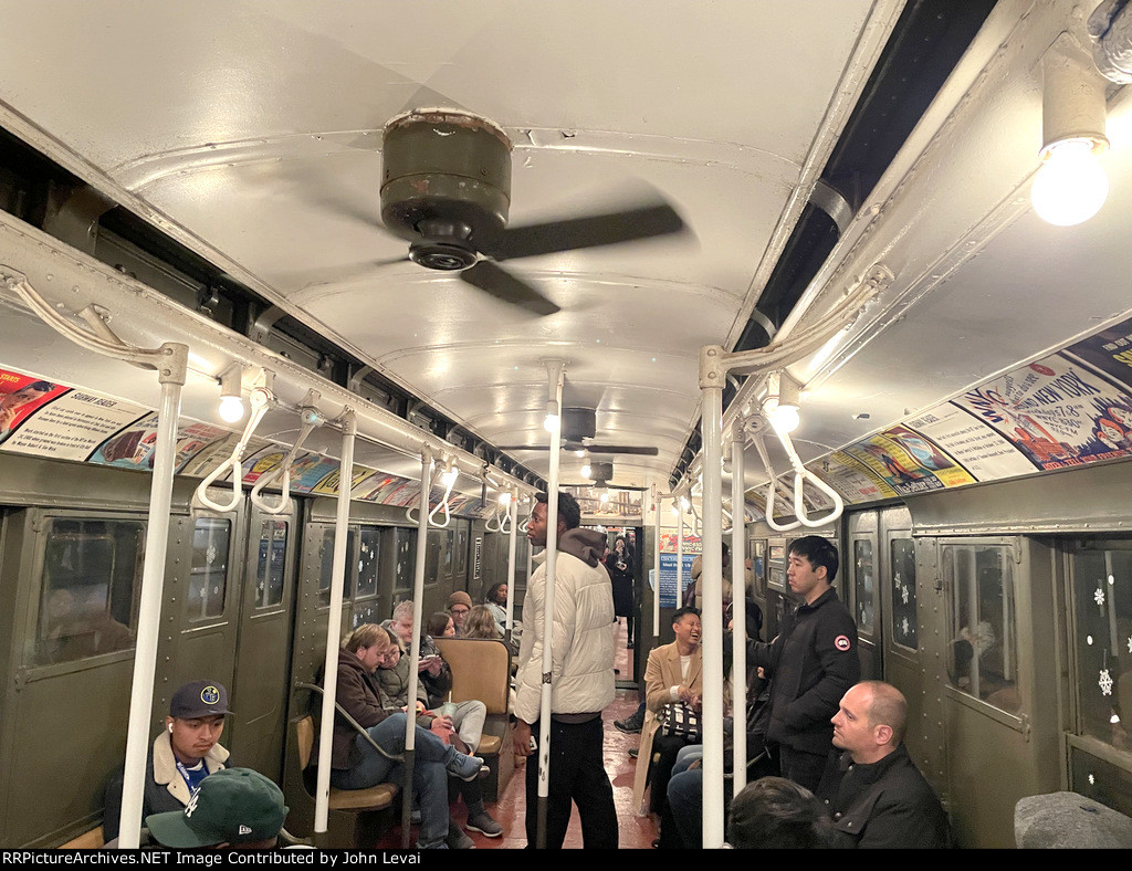 Interior of the Arnine Car with people in awe